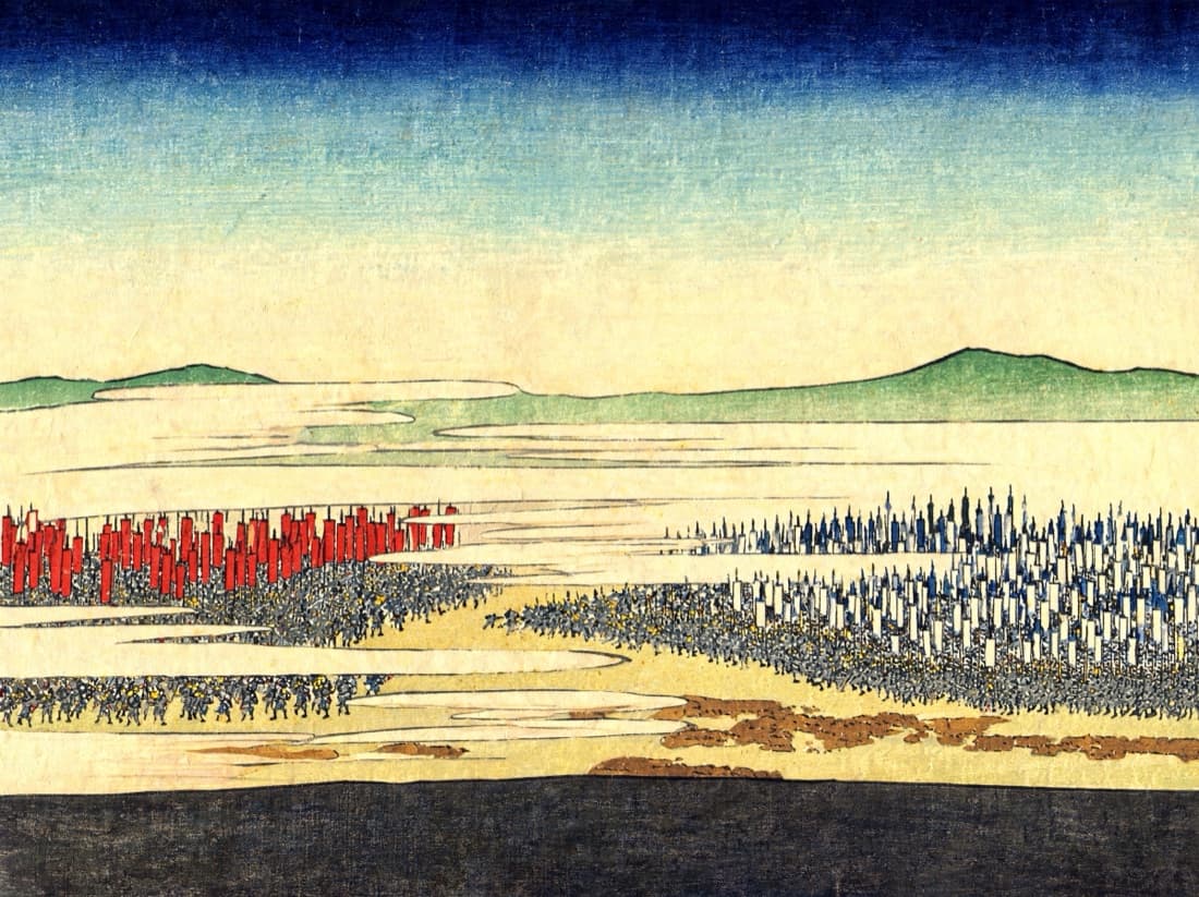 A battlefield seen from a high ridge at dawn. Two armies face each other across a valley, drawn as dense masses of banners rather than as individual men.