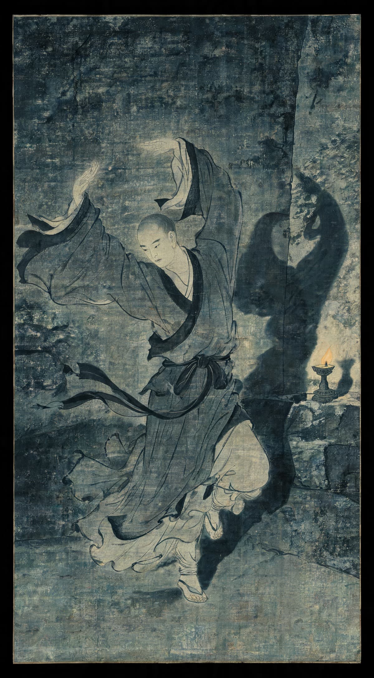 Painting of a robed figure captured mid-motion in a wide overhead arc, robes flowing, in a dark stone chamber