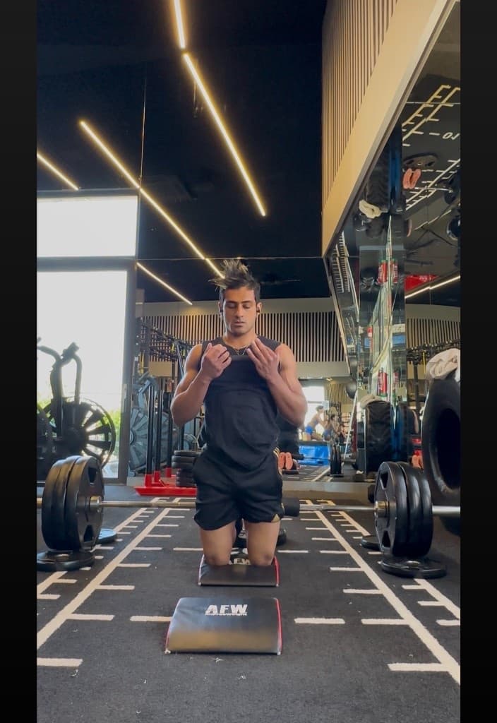 Gaurav Nandipura at nordic hamstring curl setup with barbell anchor and knee pads
